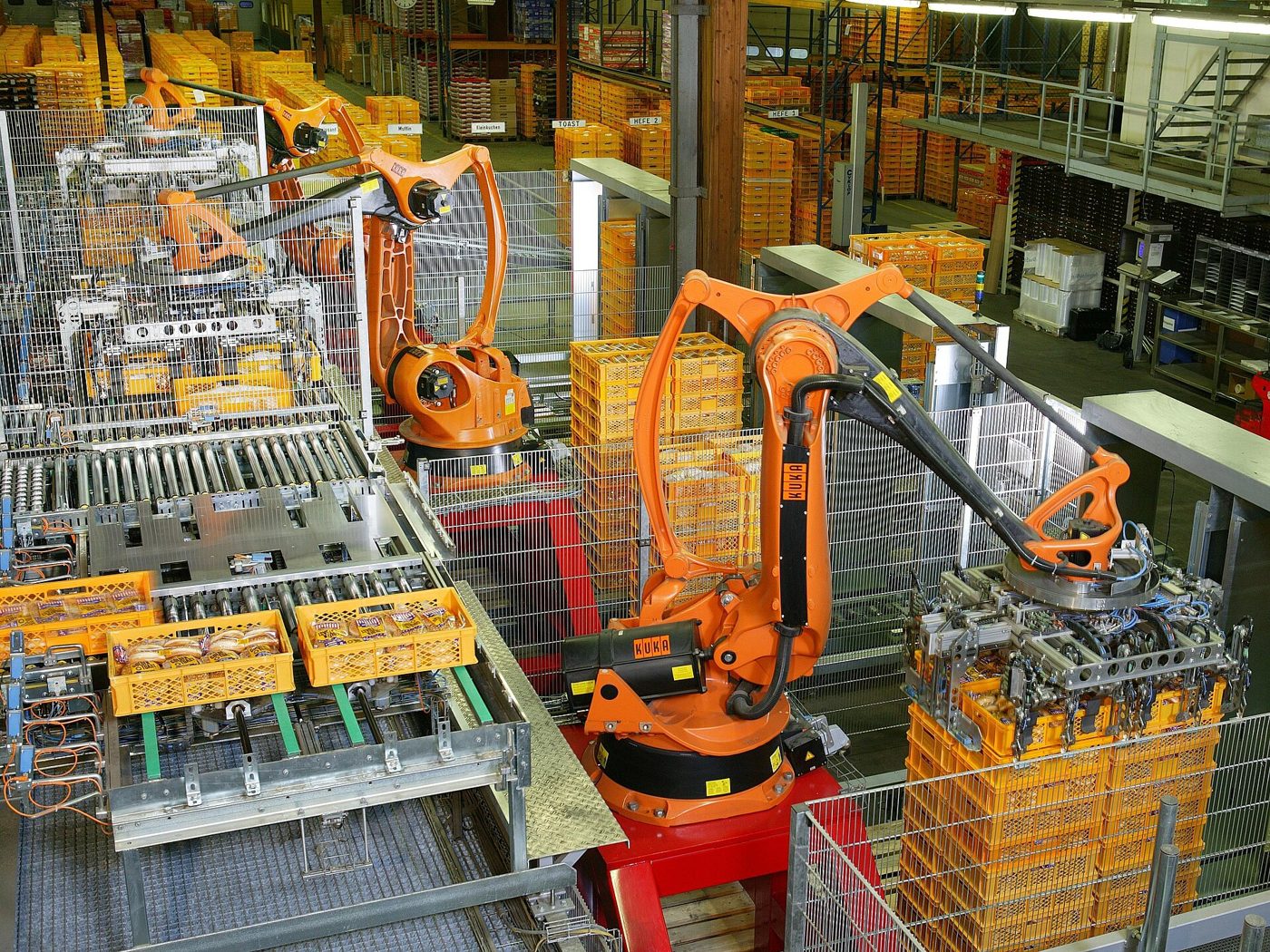 Industrial robots palletizing crates on a production line