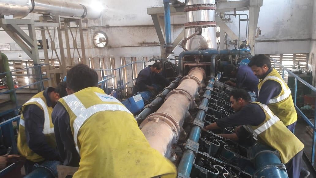 Trimurti engineers servicing a power plant engine